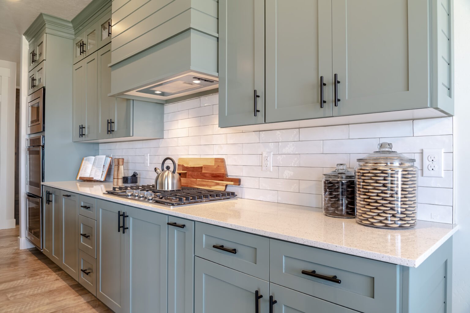 Kitchen interior with cooktop on white counter top