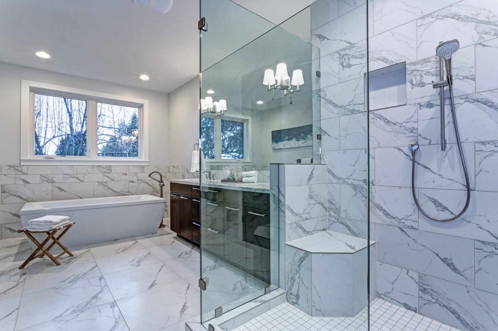 Master bathroom with carrara marble tile surround