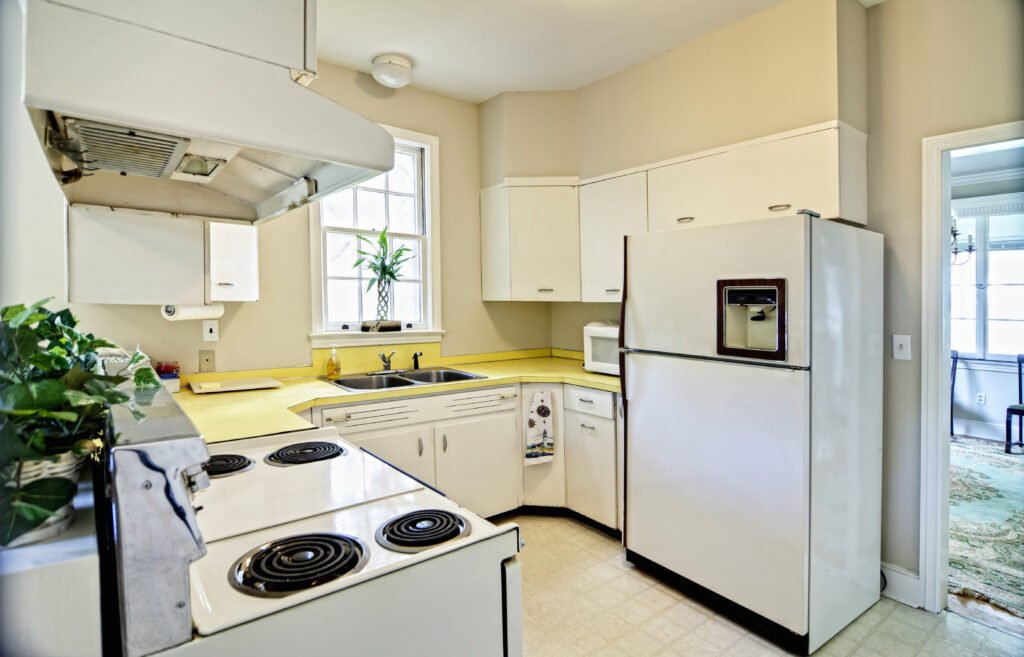 Old dated kitchen with white appliances